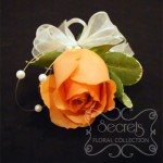 Fresh Coral Rose and Pittosporum Pin-On Corsage with Pearl Strands Accent (Top View)