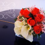 Artificial (soft-touch) white calla lilies, Charlotte red roses, pink eremurus, and ivory snow berries bridal bouquet (top-view)