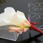 Artificial (soft-touch) white calla lily and pink mother pin-on corsage, with wine red satin wrap and double pearl pins