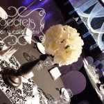 Ivory Rose Ball on Black Stand Centrepiece. Each Arrangement is Highlighted by a White Spotlight Above