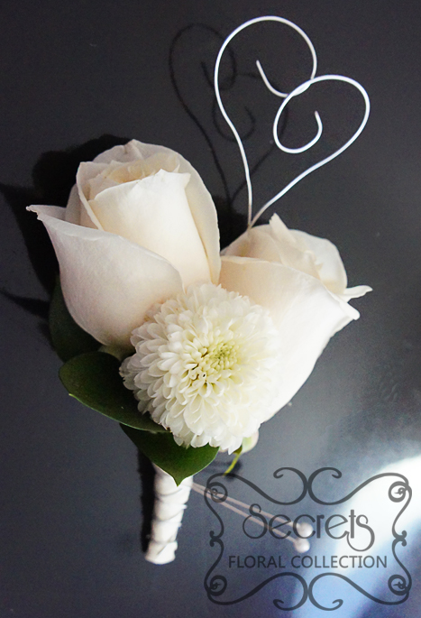 Fresh double-bloom cream roses and white ice cap mum boutonniere, with silver wrapping with silver-wire heart - Toronto Wedding Flowers Created by Secrets Floral Collection