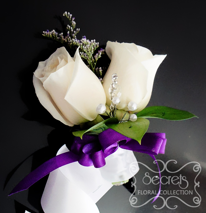 Fresh double-bloom cream roses and purple limonium wristlet corsage, with purple bow and jewel embellishments (front-view) - Toronto Wedding Flowers Created by Secrets Floral Collection