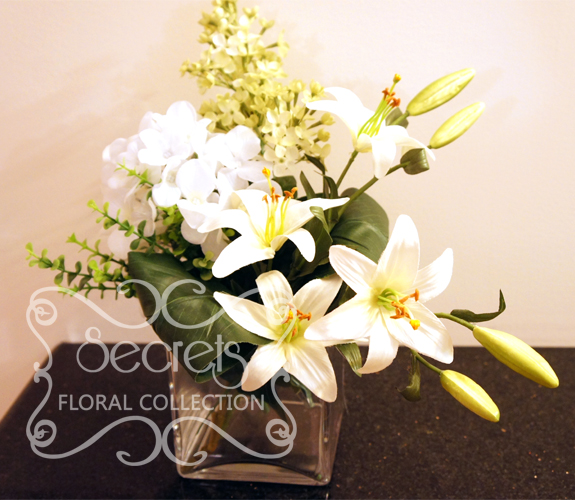 Artificial White Lilies, White Hydrangea, and Pale Green Lilac in Square Vase