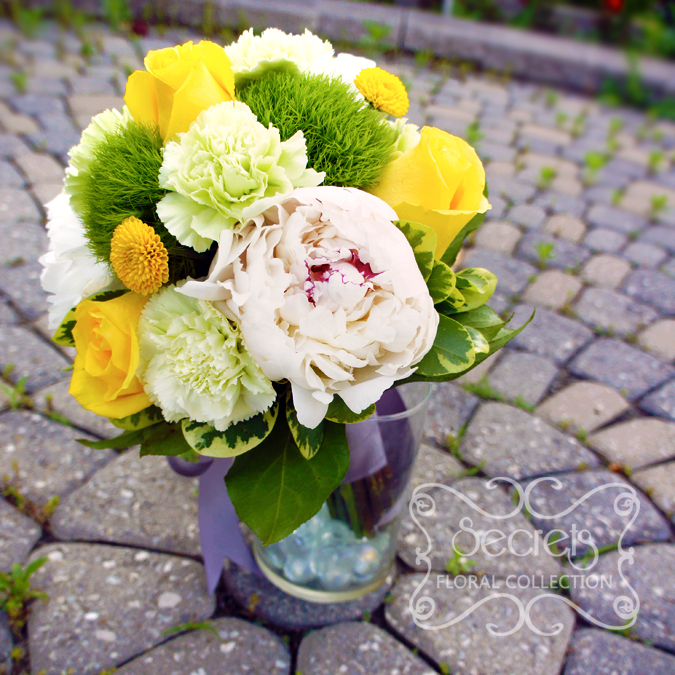 Fresh white peonies, yellow roses, green trick dianthus, light green carnations, and yellow button mums toss bouquet, with silver ribbon wrap (side-view) - Toronto Wedding Flowers Created by Secrets Floral Collection