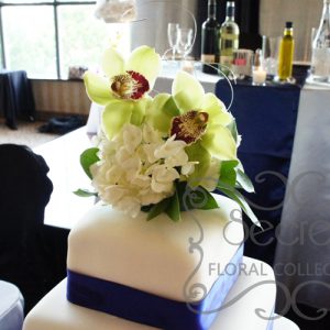 Green Cymbidium Orchids and White Hydrangea Cake Topper (on Cake)