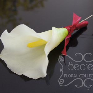 Artificial (soft-touch) white calla lily boutonniere, with wine red satin wrap and double pearl pins - Toronto Wedding Flowers Created by Secrets Floral Collection
