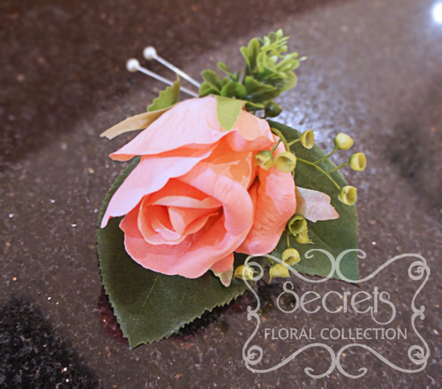 Artificial coral pink rose and and eucalyptus boutonniere (Top View) - Toronto Wedding Flowers Created by Secrets Floral Collection