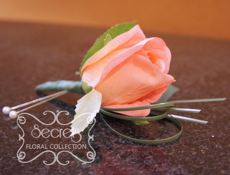 Artificial coral pink rose and and bear grass boutonniere (Side View) - Toronto Wedding Flowers Created by Secrets Floral Collection