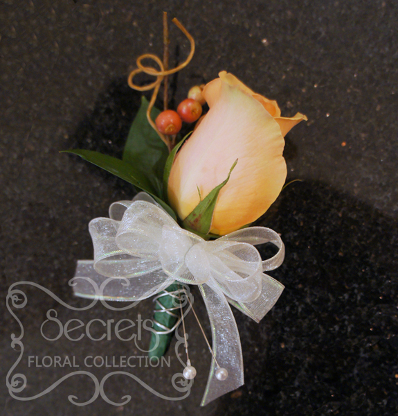 Fresh peach rose and red privet berries boutonniere with silver wire accent (Front View) - Toronto Wedding Flowers Created by Secrets Floral Collection