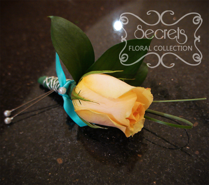 Fresh peach rose and bear grass boutonniere with tiffany blue ribbon and silver wire embellishments - Toronto Wedding Flowers Created by Secrets Floral Collection