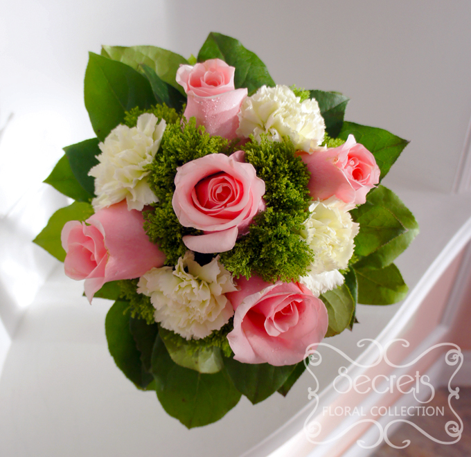 Fresh light pink roses, green carnations, and green trachelium bridesmaid bouquet, with silver satin and pearl wrap (Top View) - Toronto Wedding Flowers Created by Secrets Floral Collection
