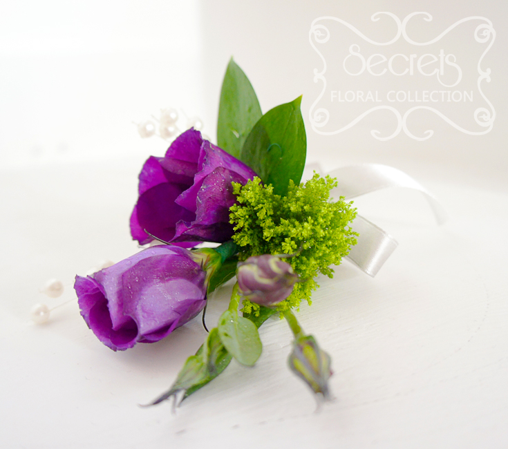 Fresh purple lisianthus and green trachelium boutonnière, embellished with pearl strands and silver ribbon (top-view) - Toronto Wedding Flowers Created by Secrets Floral Collection