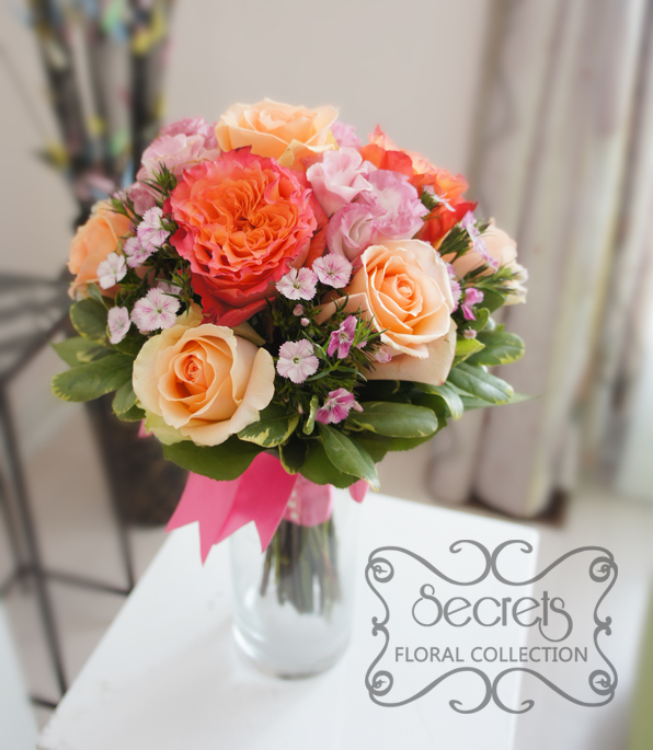 Fresh two-tone peach garden roses (free spirit), peach standard roses, bi-colour pink lisianthus, and light pink sweet william bridesmaid bouquet, with salmon pink wrap (top-view) - Toronto Wedding Flowers Created by Secrets Floral Collection