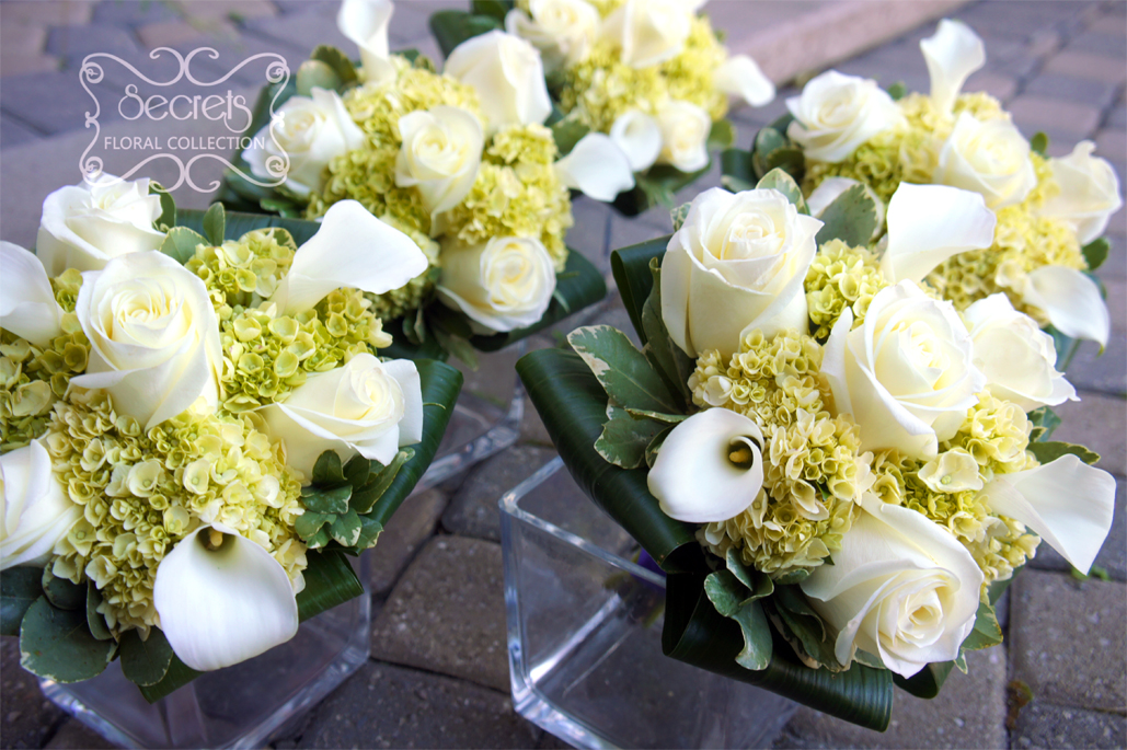 Fresh cream roses, white calla lilies, and baby green hydrangea bridesmaid bouquet, with royal purple satin wrap and crystal jewelry on it (top-view) - Toronto Wedding Flowers Created by Secrets Floral Collection