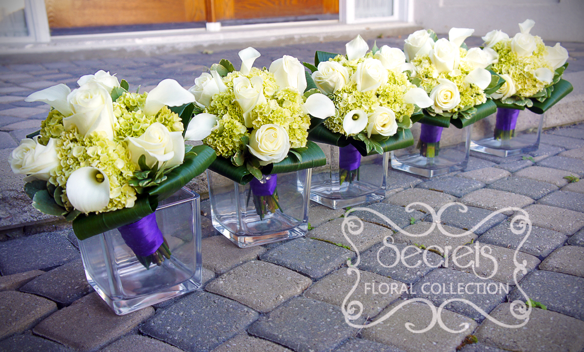 Fresh cream roses, white calla lilies, and baby green hydrangea bridesmaid bouquet, with royal purple satin wrap and crystal jewelry on it (side-view) - Toronto Wedding Flowers by Secrets Floral Collecton