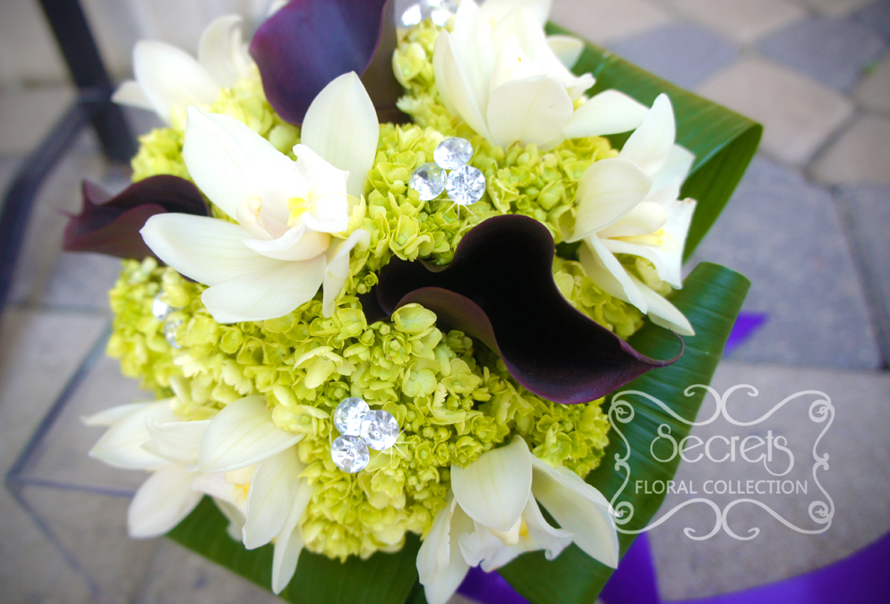Fresh cream cymbiudium orchids, purple calla lilies, and baby green hydrangea bridal bouquet, with crystal bouquet jewelry and royal purple satin wrap (close-up) - Toronto Wedding Flowers by Secrets Floral Collection