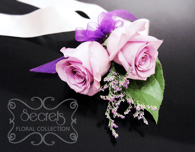 Fresh double-bloom lavender roses and misty blue limonium wristlet with purple organza bow - Toronto Wedding Flowers Created by Secrets Floral Collection