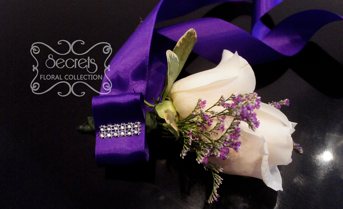 Fresh double-bloom cream roses and purple limonium wristlet, with large royal purple bow (front-view) - Toronto Wedding Flowers Created by Secrets Floral Collection