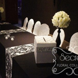 Ivory Rose Ball on Black Stand Arrangements on Receiving Table