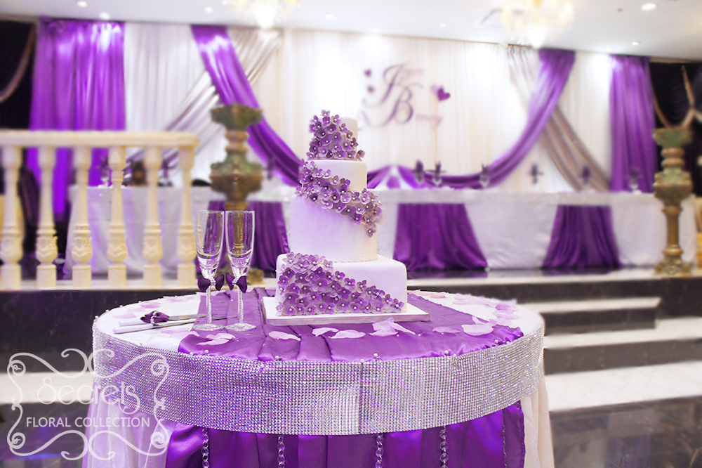 Close-up of the cake table. Beautiful hydrangea cake, surrounded with our purple champagne flutes and cake serving set