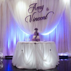 Large Purple Name Plate on Cream Voile Backdrop