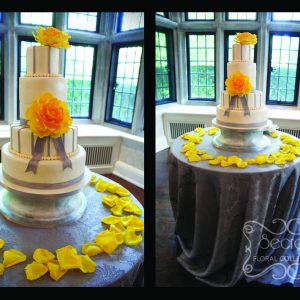 Cake table is also dressed in silver damask tablecloth. Love how the yellow petals compliments the cake