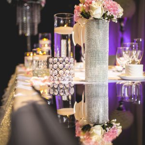 Wedding head table is also filled with light pink and cream flowers from the bridal party bouquets. Photo by Andes Lo Photography - Toronto Wedding Decor Created by Secrets Floral Collection