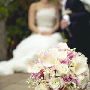 Silk (soft-touch) cream roses, blush pink calla lilies, light pink hydrangea, white bouvardia, snowberries, and baby's breath bridal bouquet, embellished with ivory ribbon and silver crystal brooch on wrap - Toronto Wedding Flowers by Secrets Floral Collection
