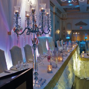 Head table was filled with crystal candelabras and candle holders to add bling and sparkles - Toronto Wedding Decor Created by Secrets Floral Collection