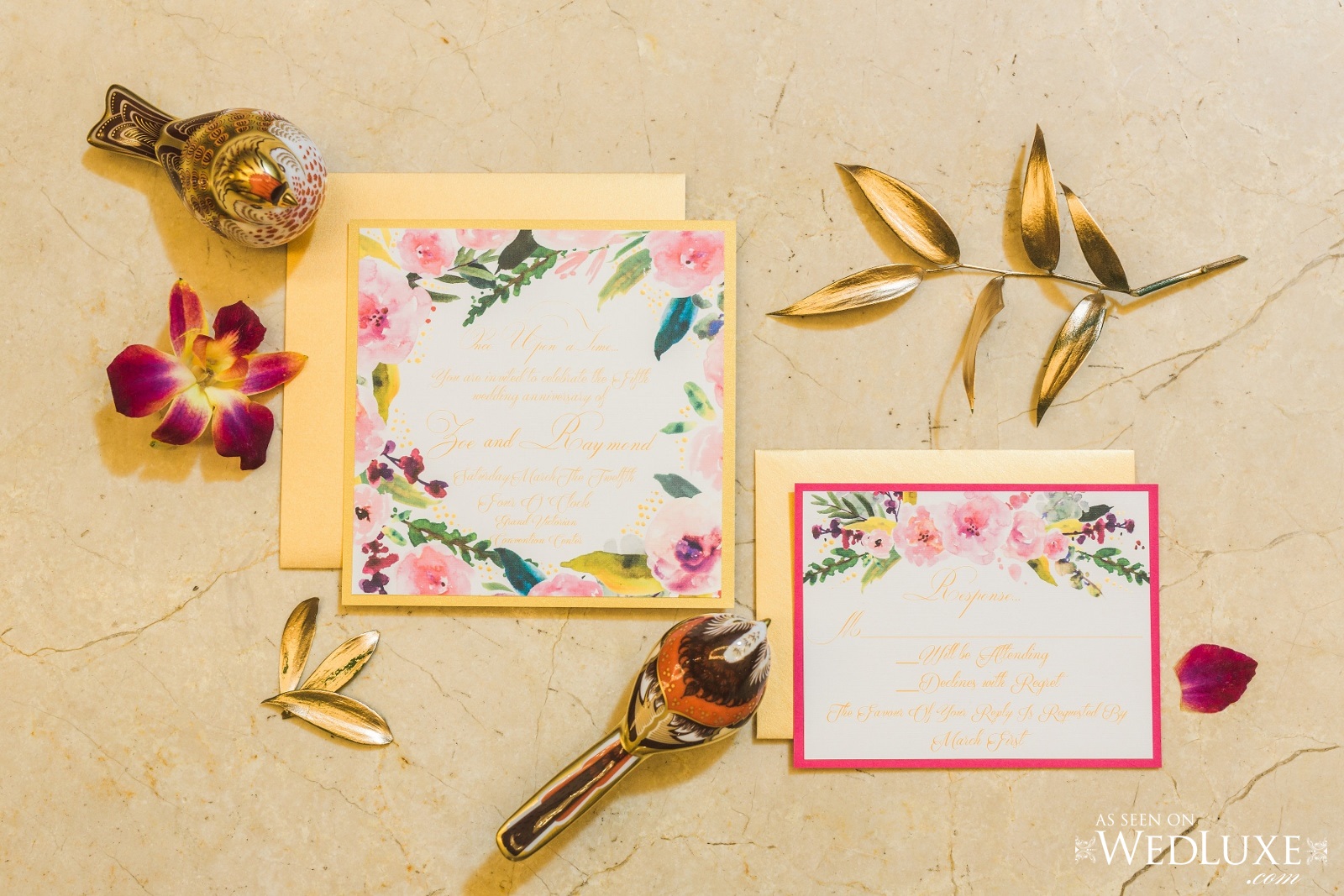 Detail shot of gold foliage, floral themed wedding invitations and decorate gold birds. Cinderella themed style shoot located at the Victorian Convention centre, Missisauga.
