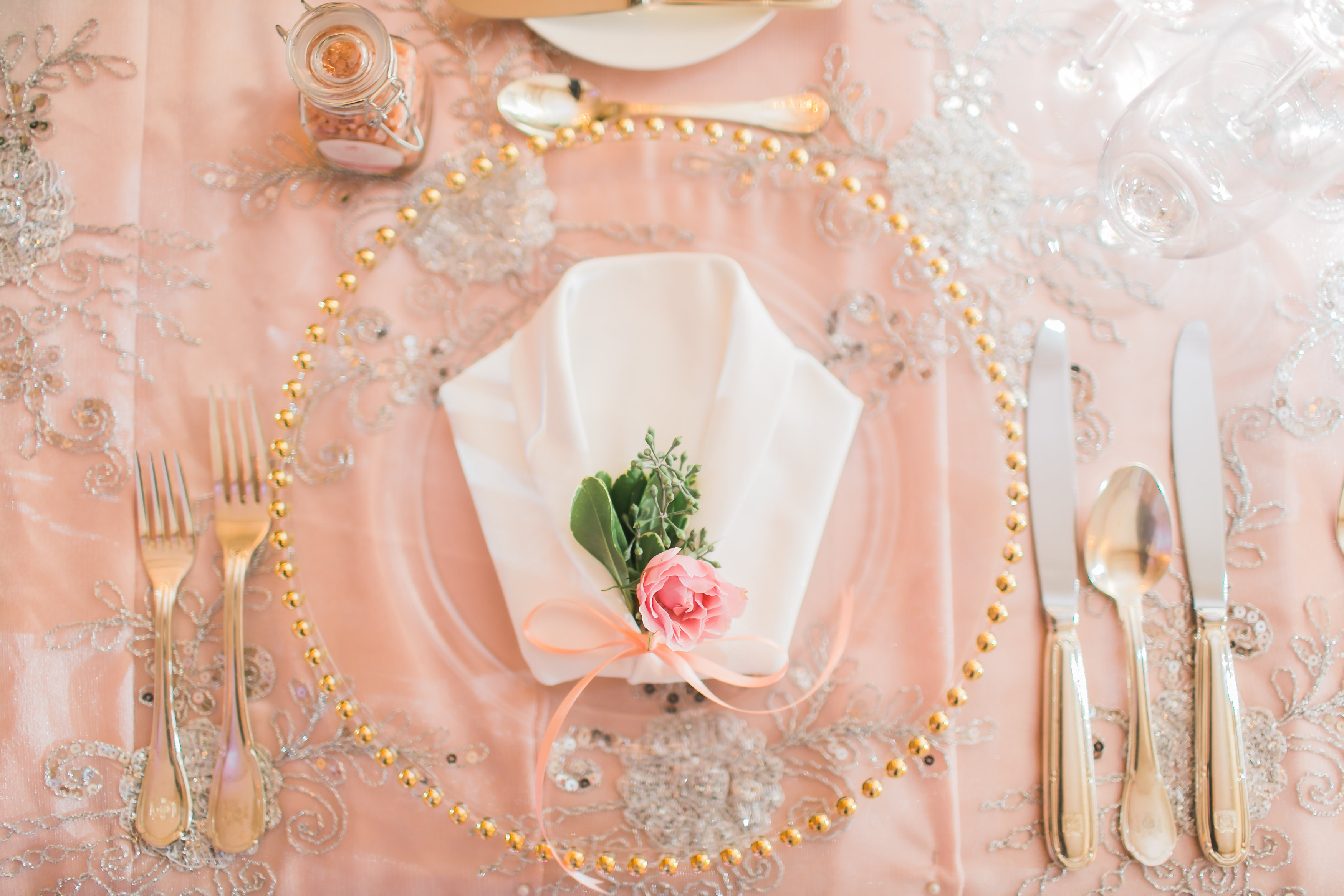 Gold beaded glass charger plate for bride. Toronto wedding flower and decor at Graydon Hall by Secrets Floral.