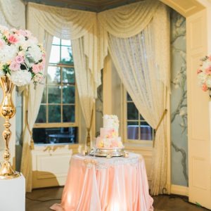 Wedding cake table in blush pink and gold. Toronto wedding decor at Graydon Hall by Secrets Floral.